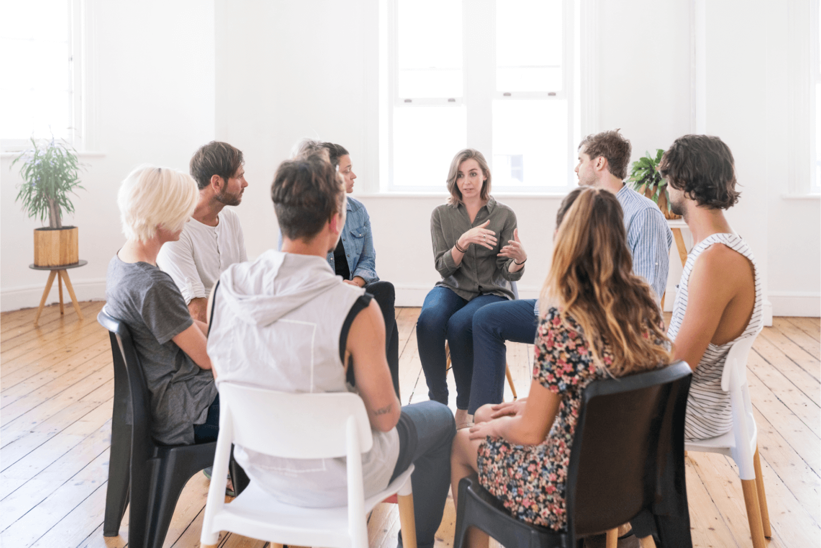 A woman talking to a support group