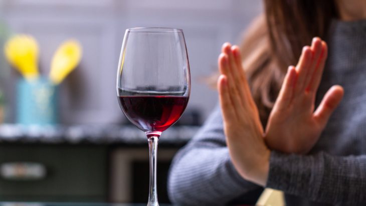Woman saying no to alcohol after drug and alcohol addiction treatment