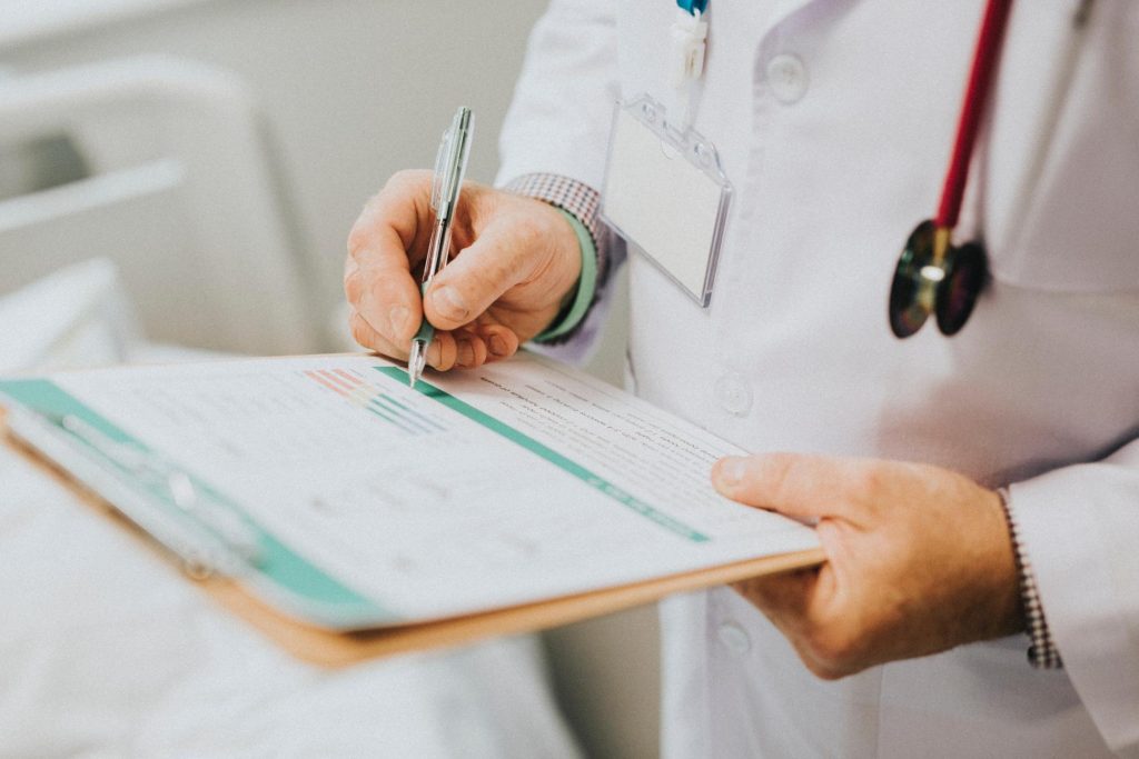 Close up of doctor writing an opioid prescription