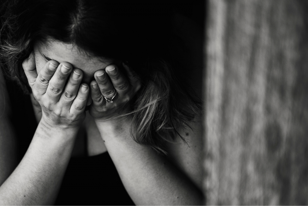 Black and white close up of a woman crying
