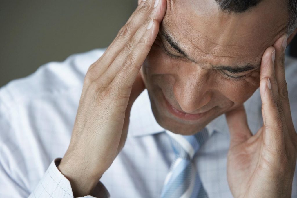 Close up of a man in pain because of opioid addiction