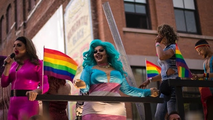 Queer people dressed in drag at a Pride parade