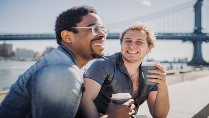 Two gay men drinking coffee 