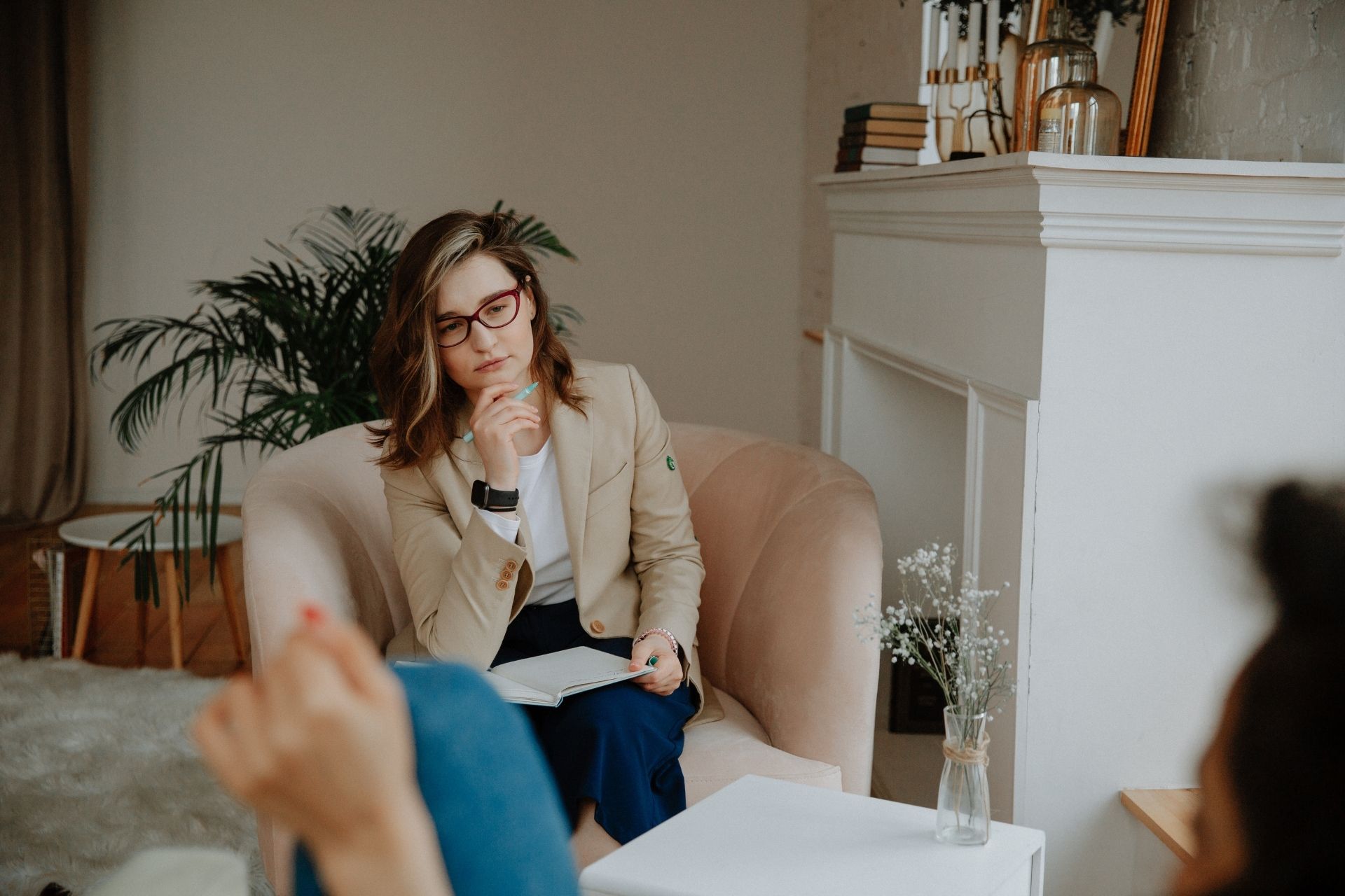 A psychotherapist listening to a client