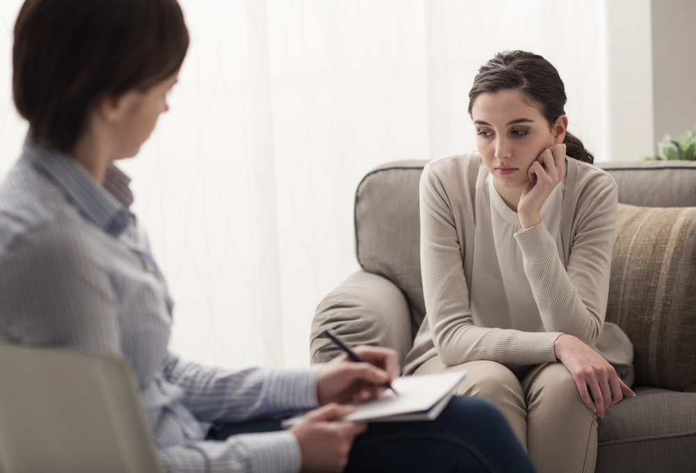 Unattentive female patient with her therapist