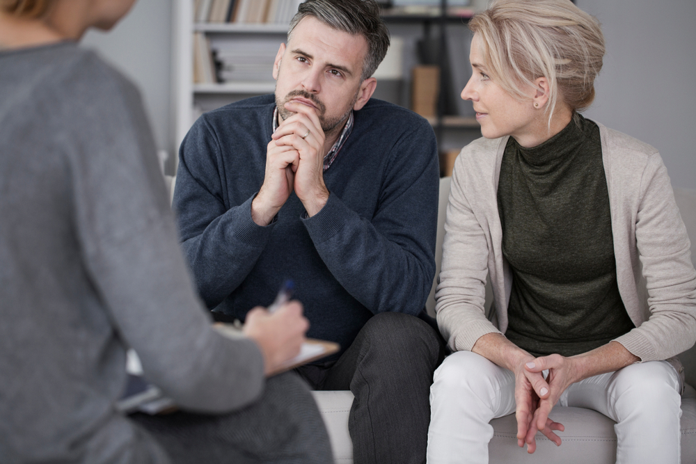 Man and woman taking partner therapy