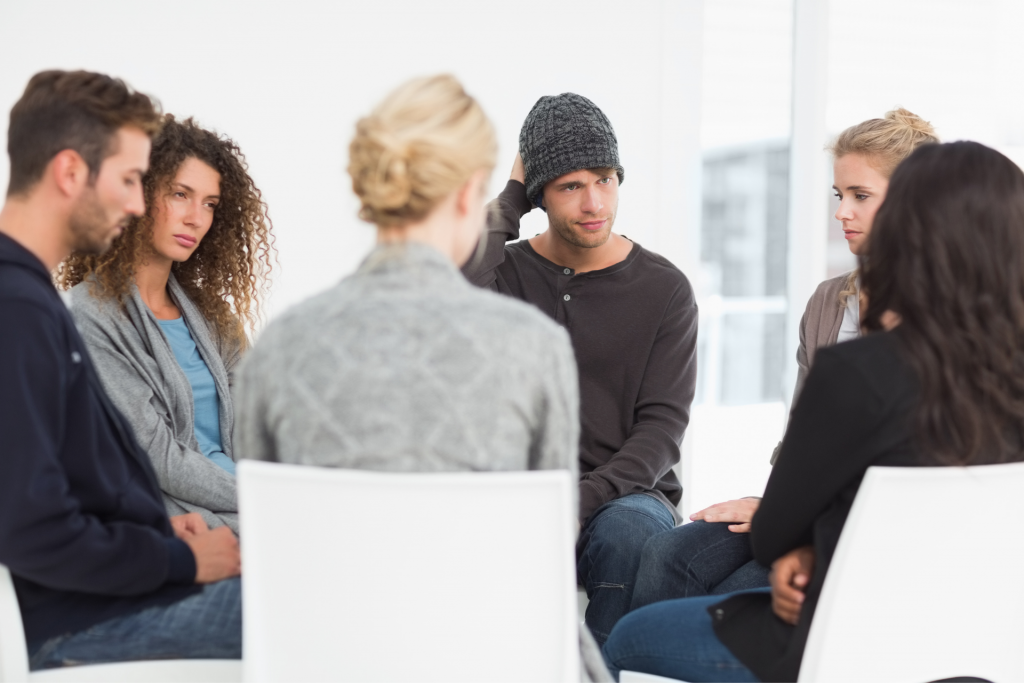 Five people in group therapy in addiction rehab
