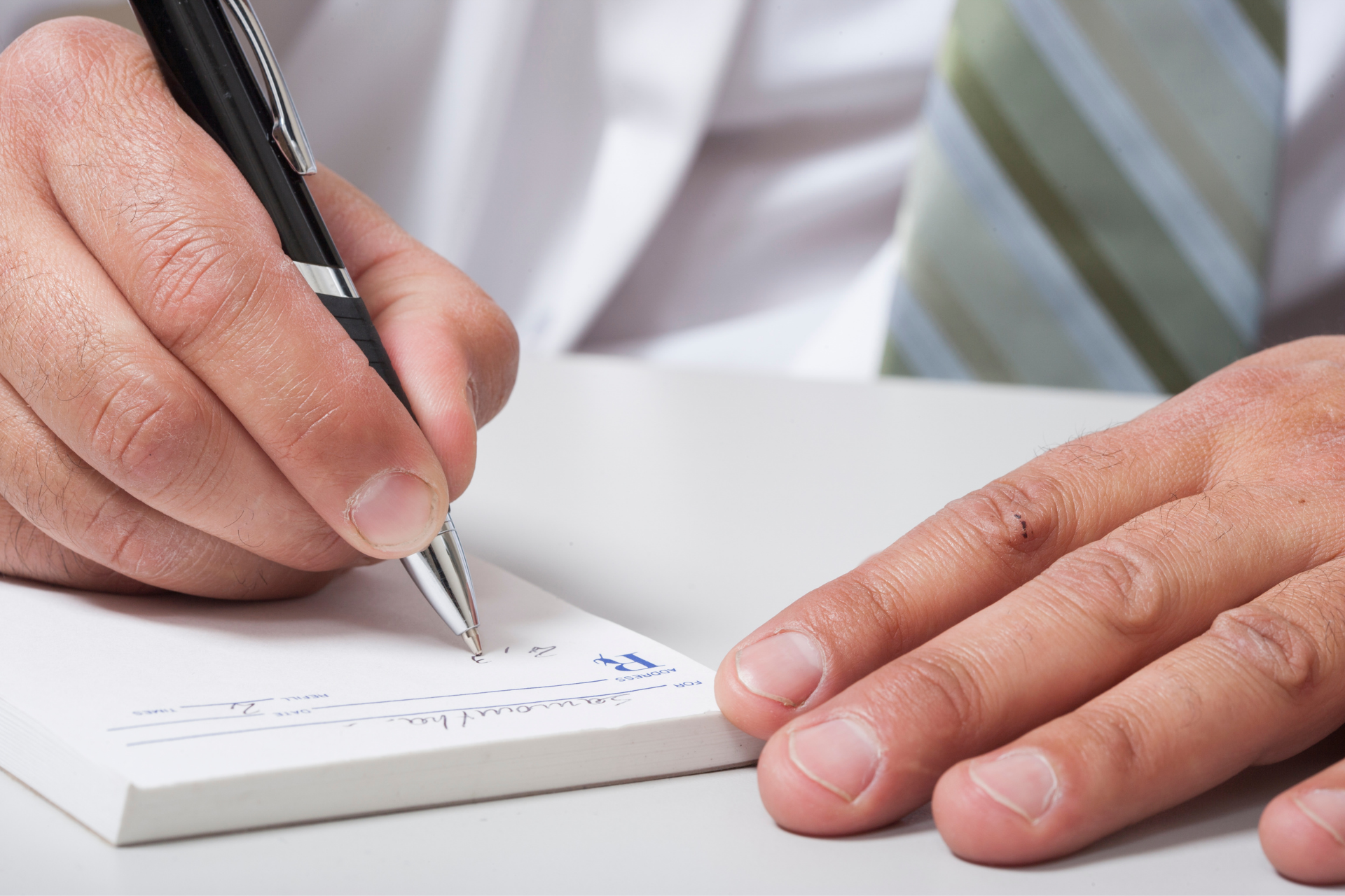 A doctor writing out a prescription