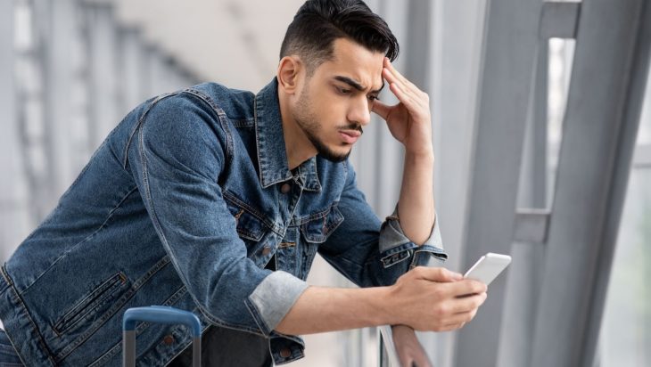 A man who is upset after doomscrolling