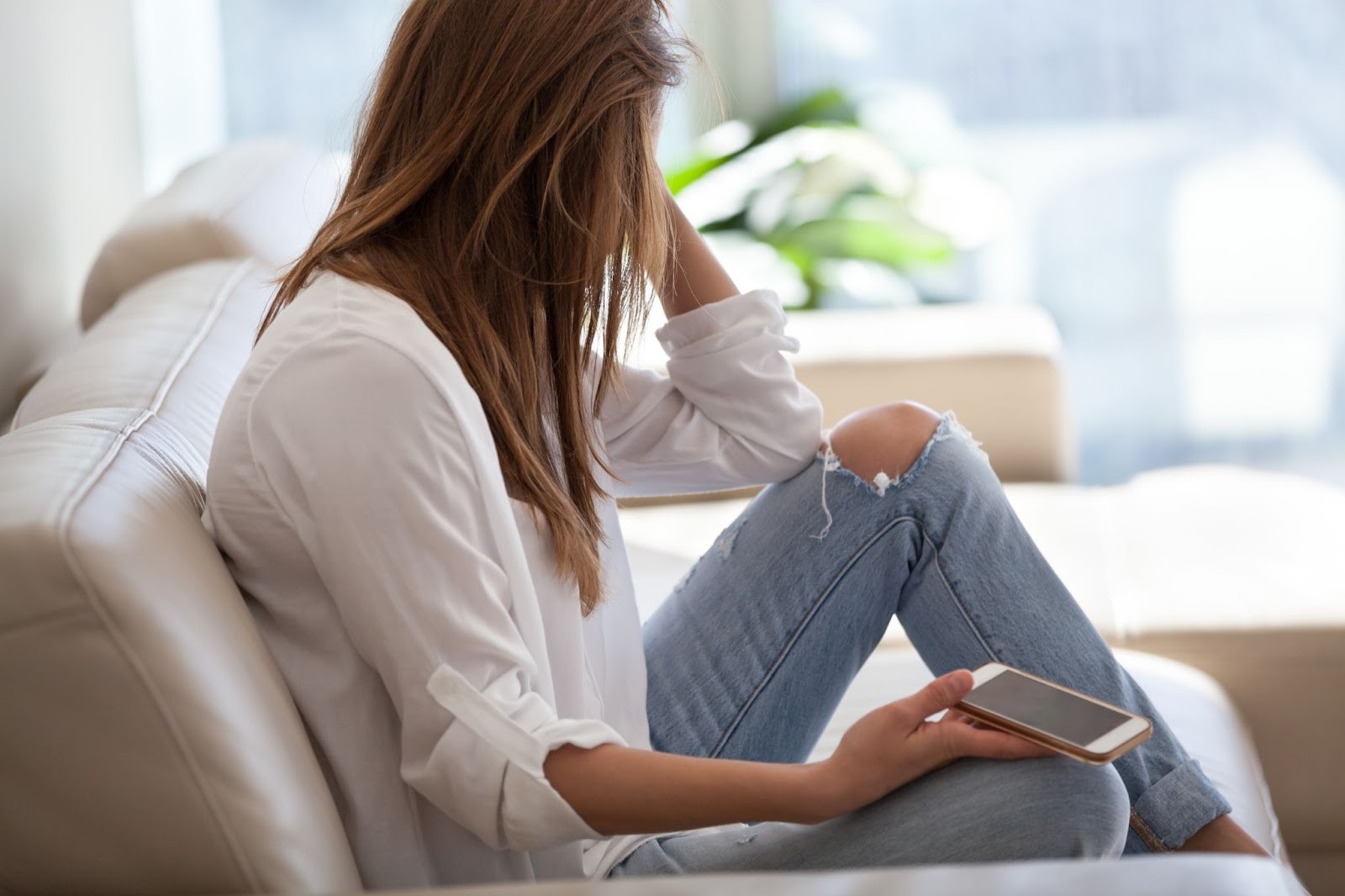 A woman thinks about an addictive substance after feeling upset from doomscrolling