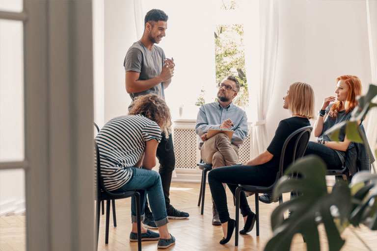 Participants attending group therapy for addiction