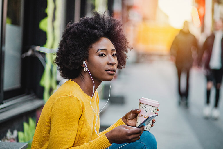 a woman listening to a mental health podast