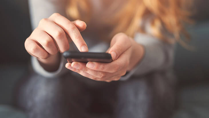 A girl on her phone talking to people online