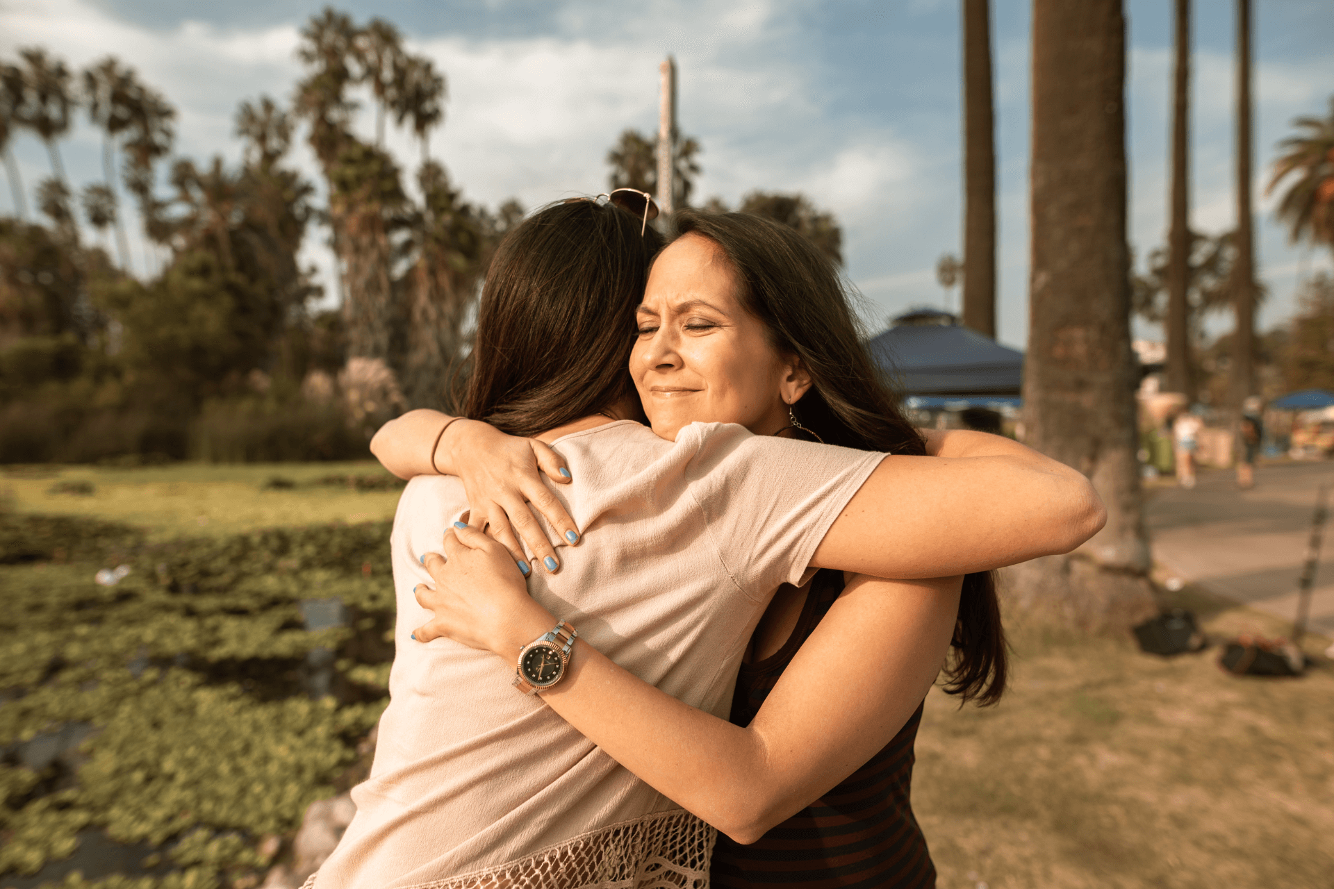 Two women hugging each other