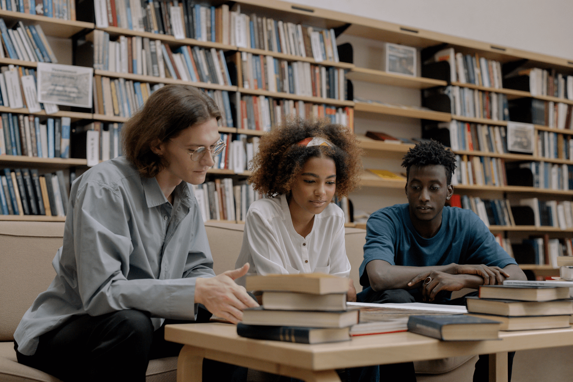 Three high school students studying together