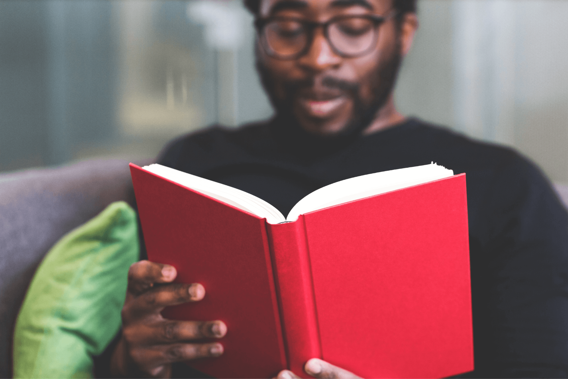 A man reading a book about mental health