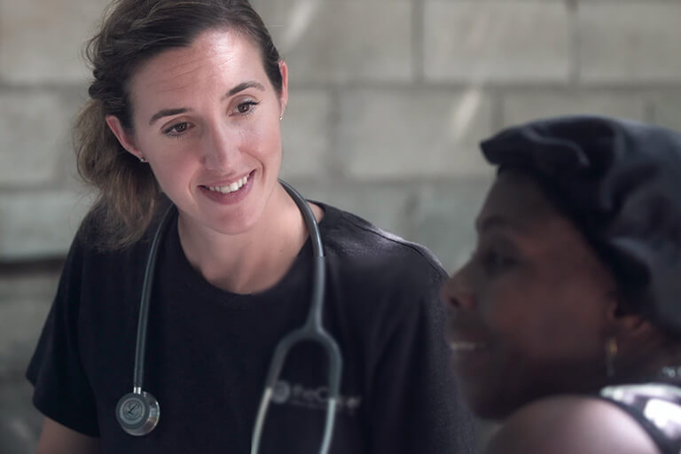 A female doctor attending to a female patient