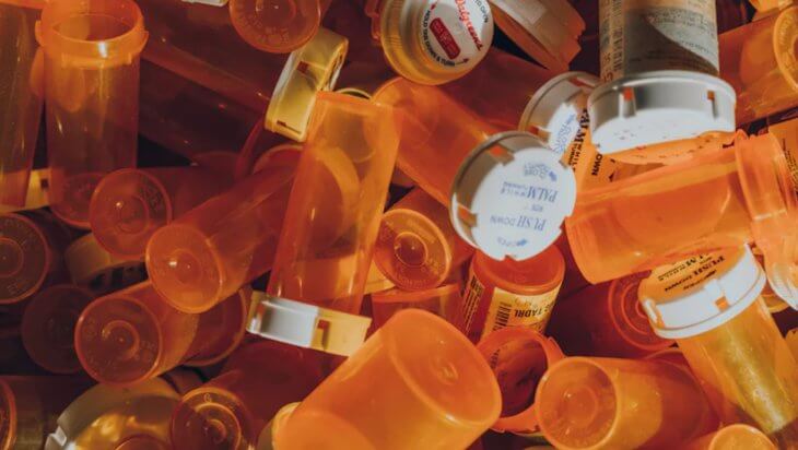 A pile of empty prescription bottles.