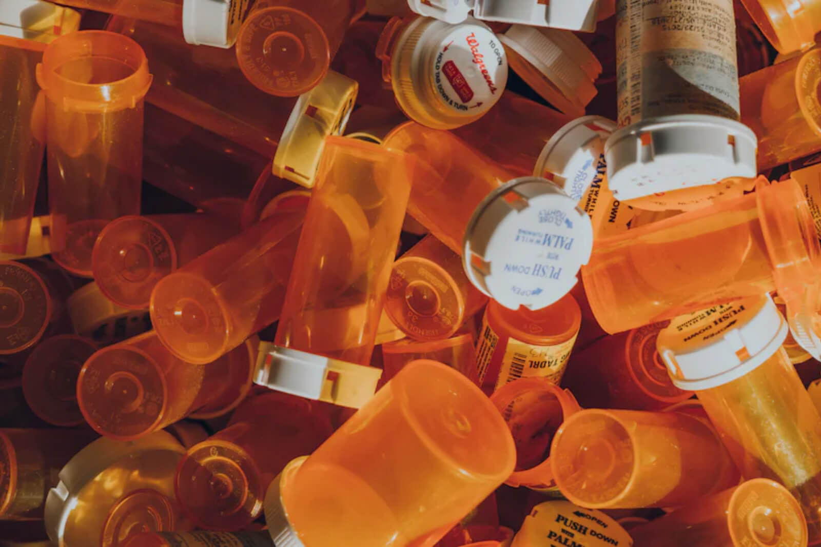 A pile of empty prescription bottles.