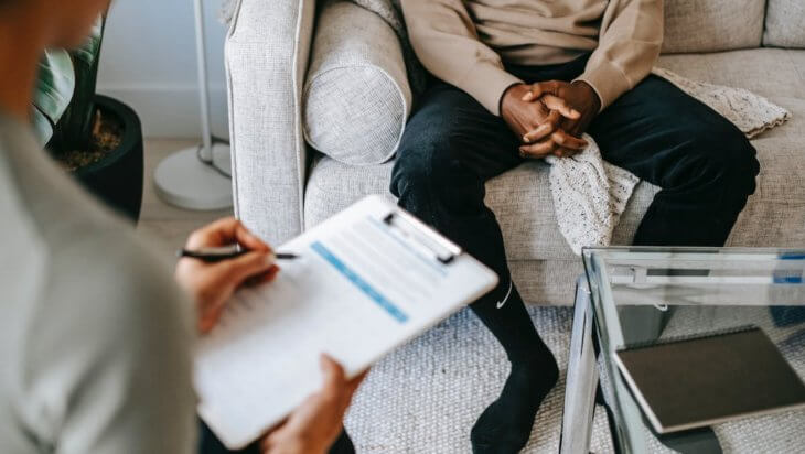 A patient talking to a doctor during a counselling session.