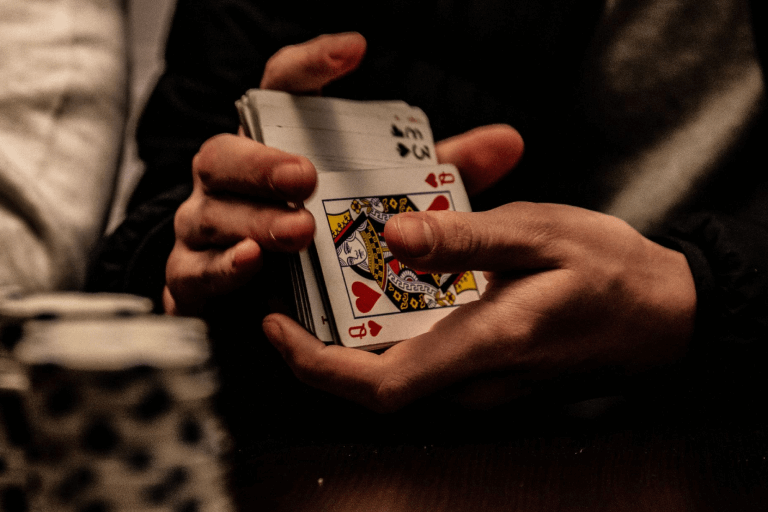 A person shuffling cards. 
