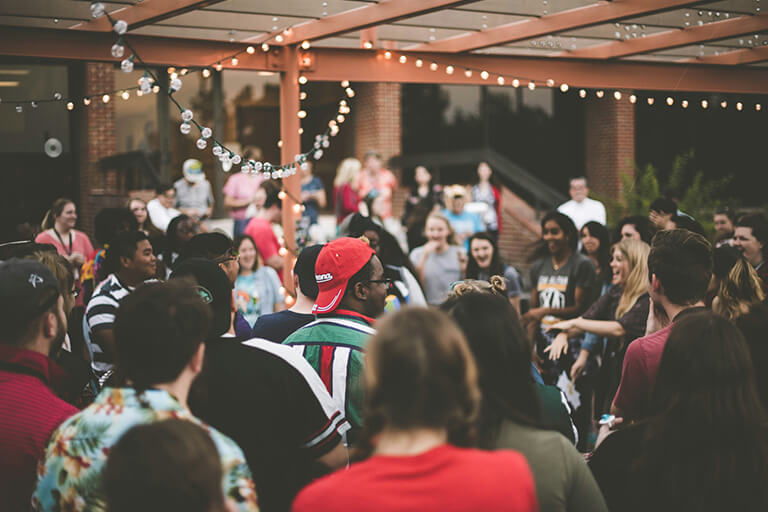An outdoor party with a large group of people