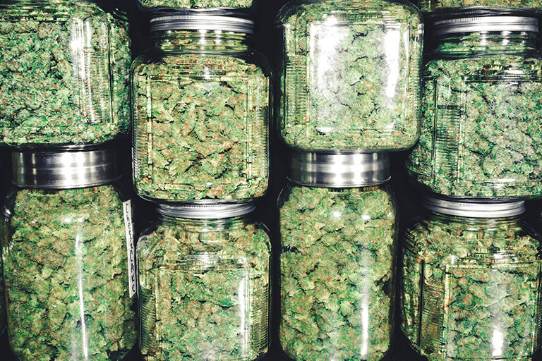 jars of cannabis stacked on top of each other
