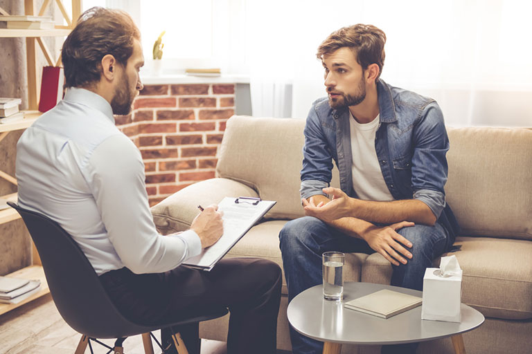 A male patient asking his addiction therapist some questions