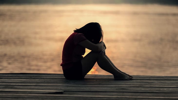 Sad woman by the sea