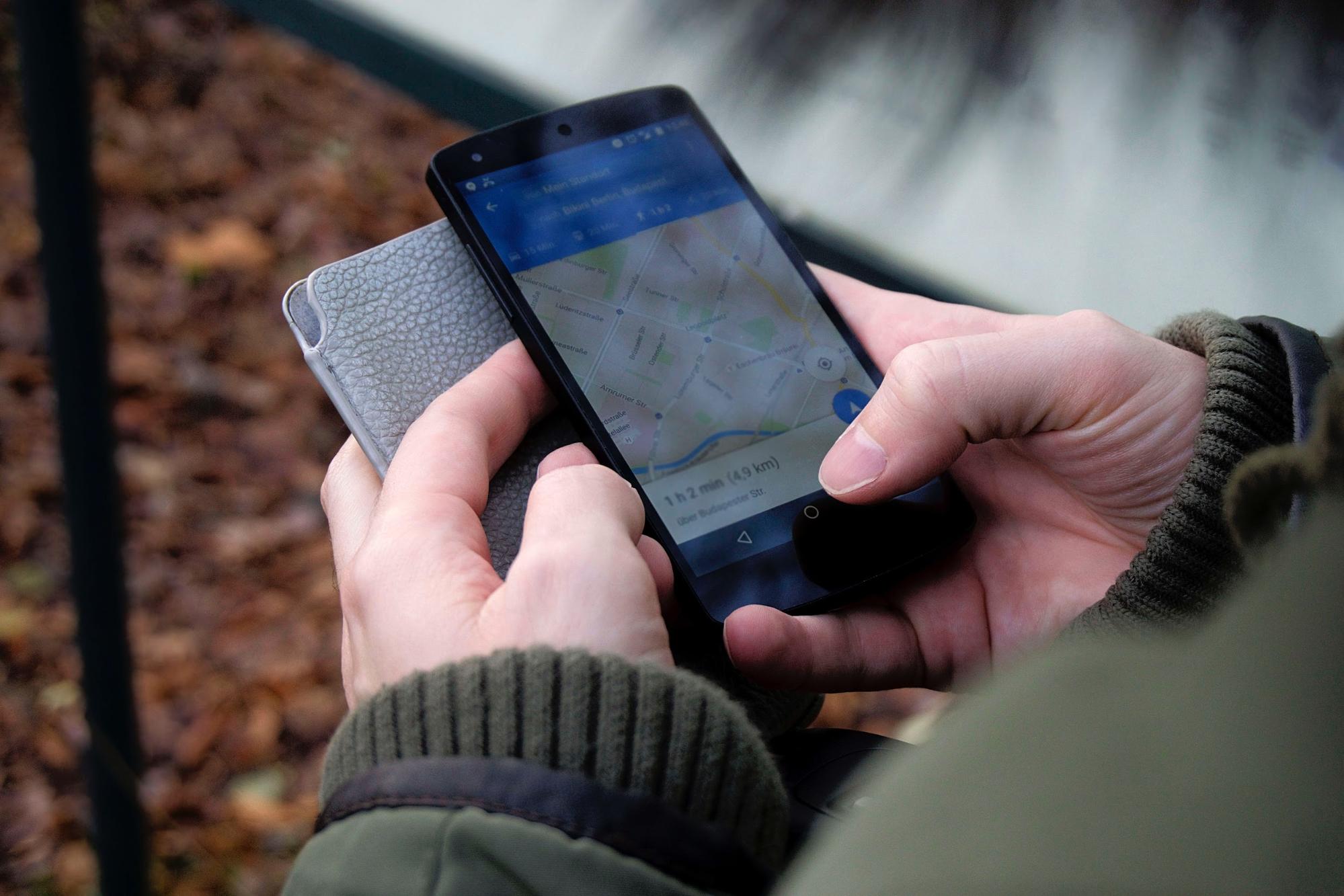 Close up of a person using Google Maps addiction recovery tools