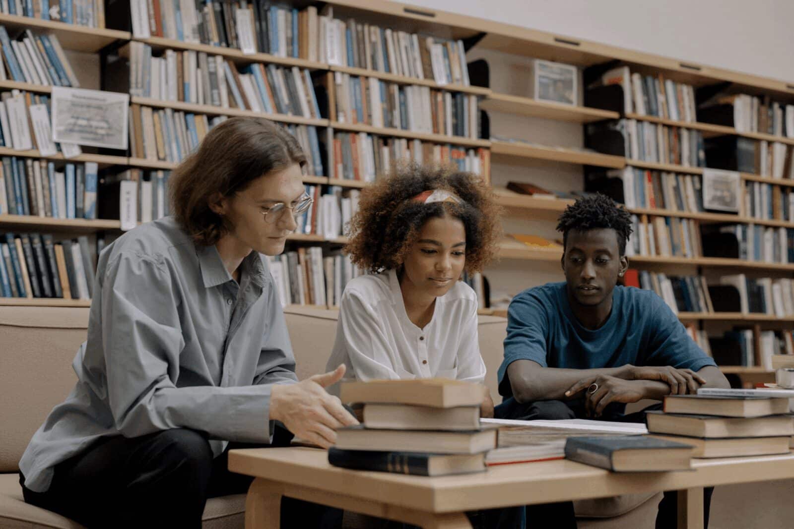 Three high school students studying together