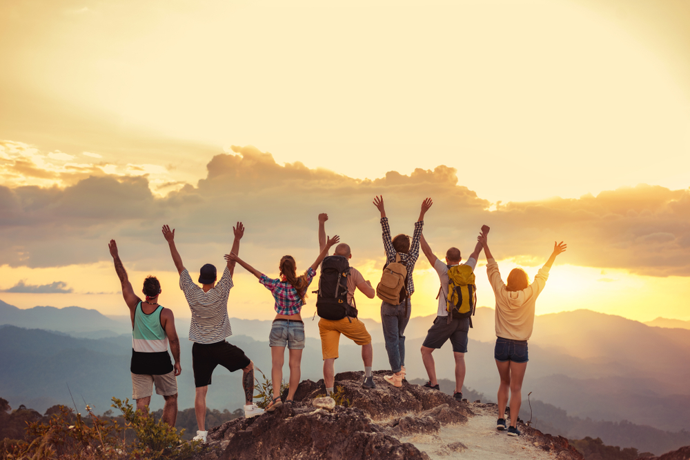 Group of friends on a mountain summit