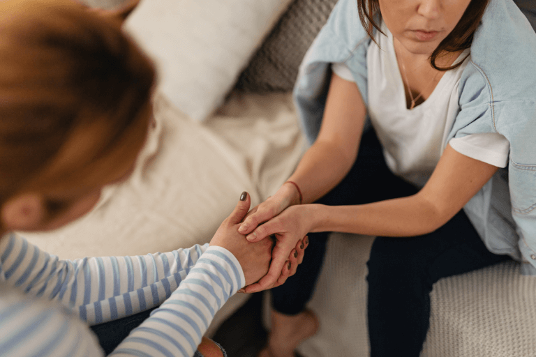 a woman receiving support from a family member