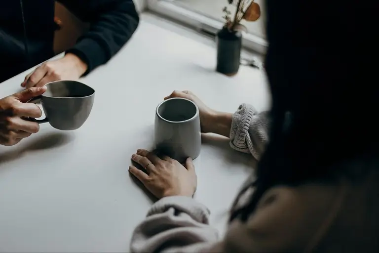 Individual therapy session with coffee