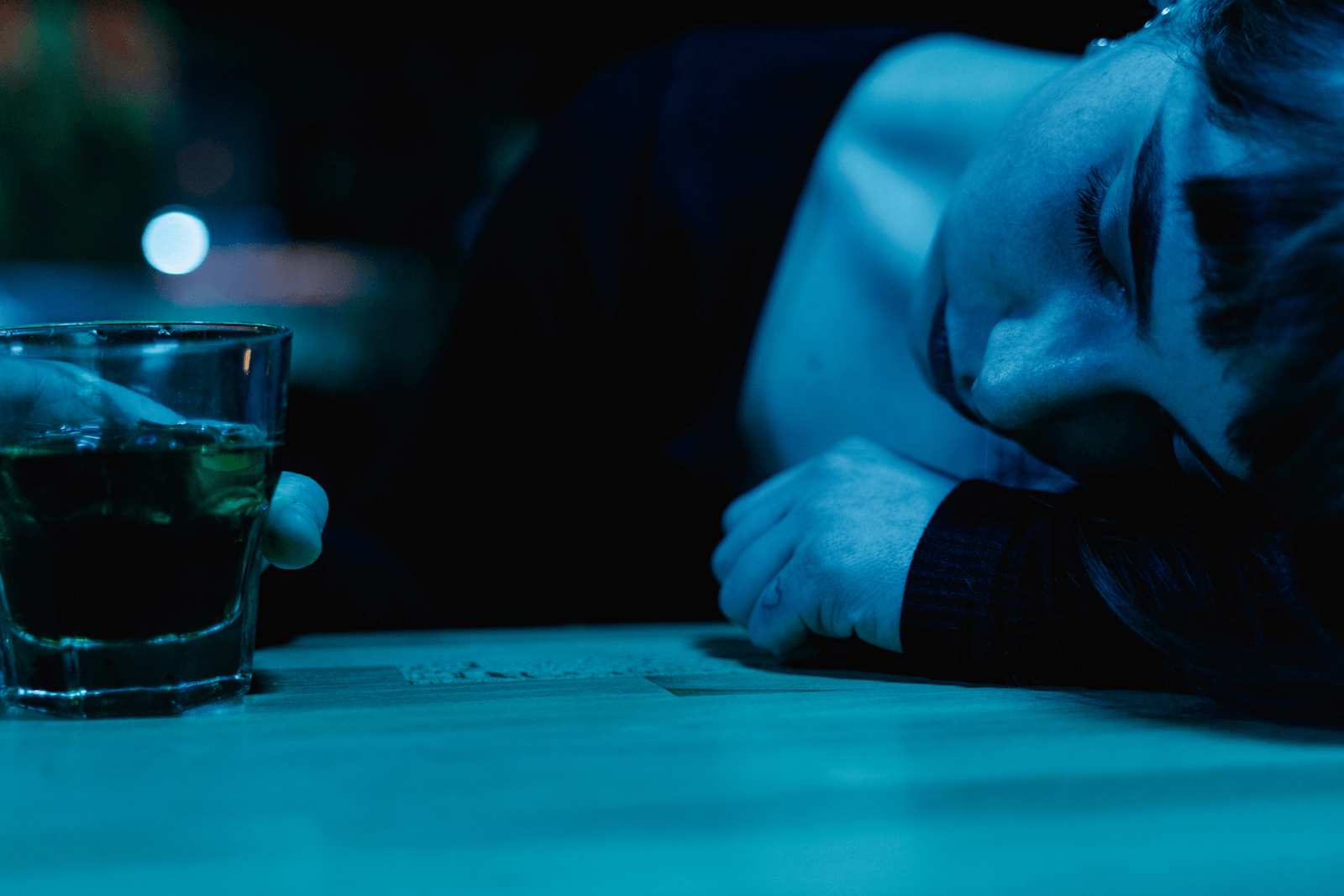 A woman having a drink at a bar